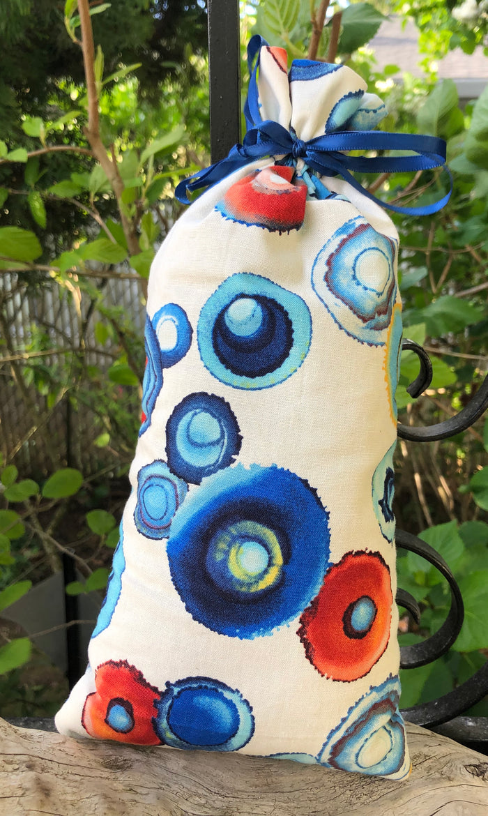 This Blue and Red Spheres on White base Cotton Lavender Pillow is useful in diminishing stress, easily fits on your bed or couch (or car) and makes a unique gift. The contents of each pillow is lavender, and only lavender, thus there are no other fillers. Lavender has plenty of its own natural oils, so give it a gentle squeeze to slightly bruise the buds to draw out more fragrance. This pillow should not be heated or put into a microwave oven.