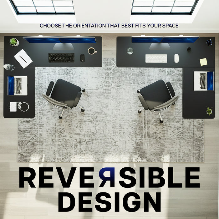 Two office desks with reversible design feature on a light wood floor.
