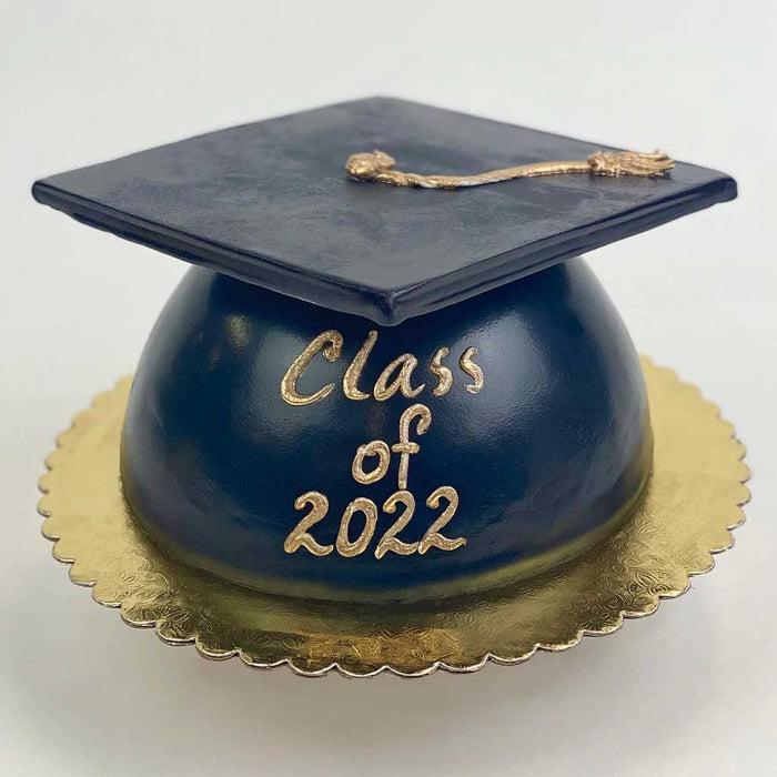 Black Grad Cap Cake featuring a golden tassel, gold base, and a βClass of 2022β message in gold