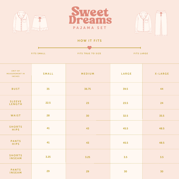 A size chart for The Darling Effect's Jolly Sprig Sweet Dreams Pajama Shorts Set, featuring bust, sleeve, waist, hip, and inseam measurements (in inches) for sizes SmallโX-Large. Showcases a pink and gold cozy pajama shorts set.
