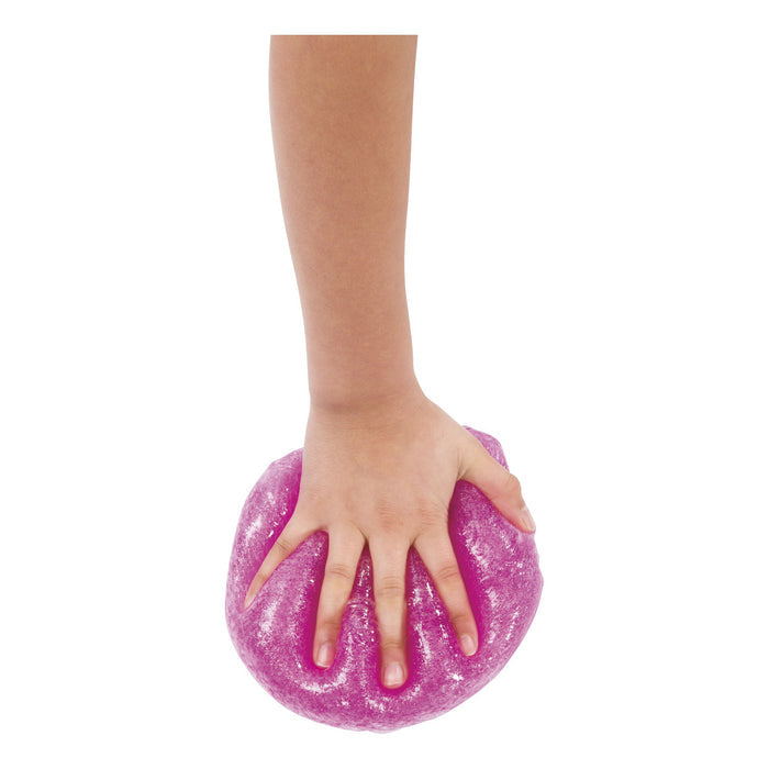 A hand presses down on a mound of Toysmith Glitter Slime, causing it to spread under the fingersโa fun sensory play activity by Toysmith shown against a white background.