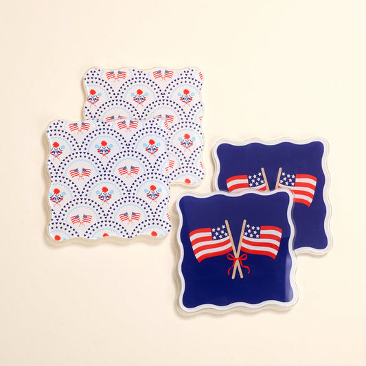 The Darling Effect All-American Darling Table Talk Acrylic Coaster Set includes four scalloped coasters—two with American flags and flowers on white, two with crossed flags on blue—perfect for patriotic table décor.