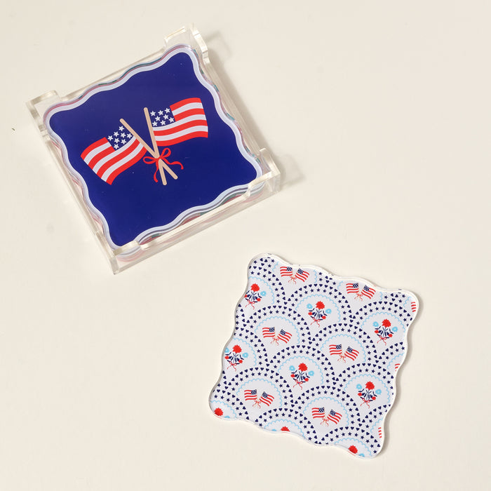 The Darling Effect’s All-American Darling Table Talk Acrylic Coaster Set features vibrant coasters adorned with crossed flags and patriotic florals—perfect table décor for any patriotic gathering.