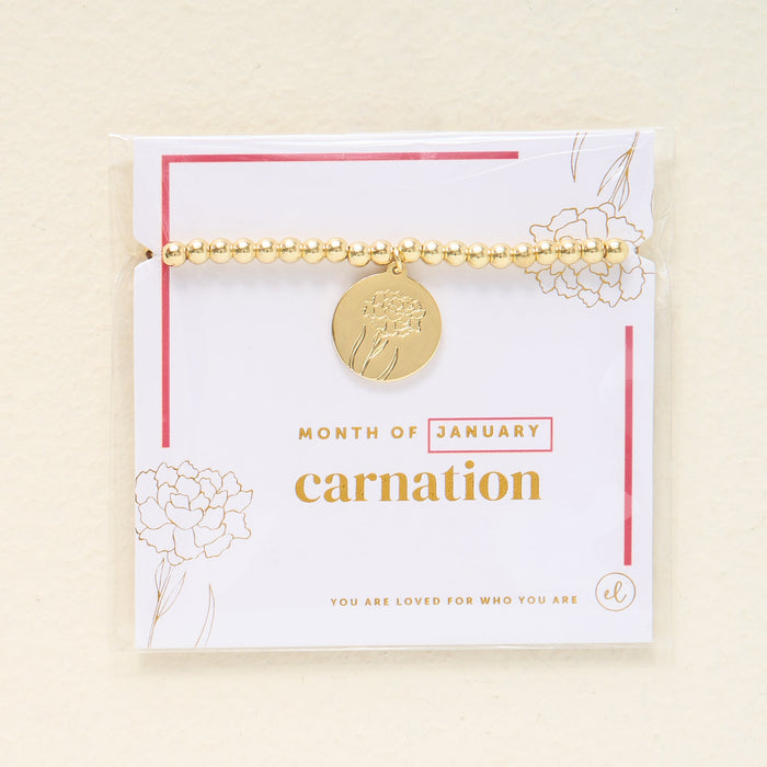 The Darling Effect Birth Flower Beaded Charm Bracelet features a gold carnation charm for January, presented on a "You are loved for who you are" card—an ideal meaningful gift.