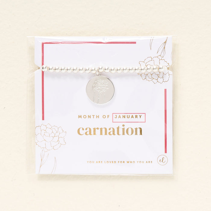 The Darling Effect Birth Flower Beaded Charm Bracelet features silver beads, a round carnation-engraved charm, and gold and pink accents. Gift-ready on a "Month of January" card with flower illustrations—perfect for celebrating a January birthday.