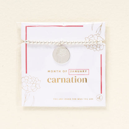The Darling Effect Birth Flower Beaded Charm Bracelet features silver beads, a round carnation-engraved charm, and gold and pink accents. Gift-ready on a "Month of January" card with flower illustrations—perfect for celebrating a January birthday.