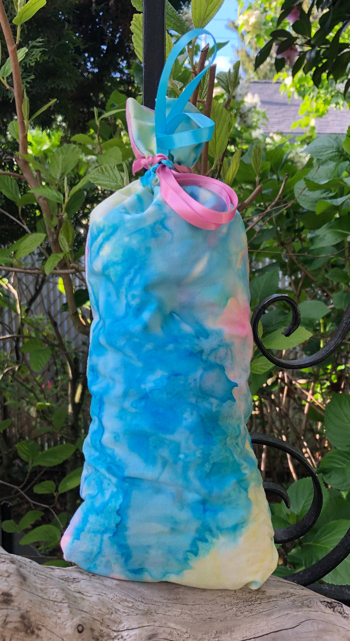 This Blue  Pink and Pale Yellow Batik cotton Lavender Pillow is useful in diminishing stress, easily fits on your bed or couch (or car) and makes a unique gift. The contents of each pillow is lavender, and only lavender, thus there are no other fillers. Lavender has plenty of its own natural oils, so give it a gentle squeeze to slightly bruise the buds to draw out more fragrance. This pillow should not be heated or put into a microwave oven.