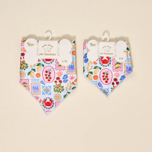 Two The Darling Effect Bow-Wow Pet Bandana-Ciao Bella accessories in L/XL and S/M, with a Mediterranean-inspired print of crabs, lemons, tomatoes, shells, and sardines on light blue—perfect for stylish pet fashion.