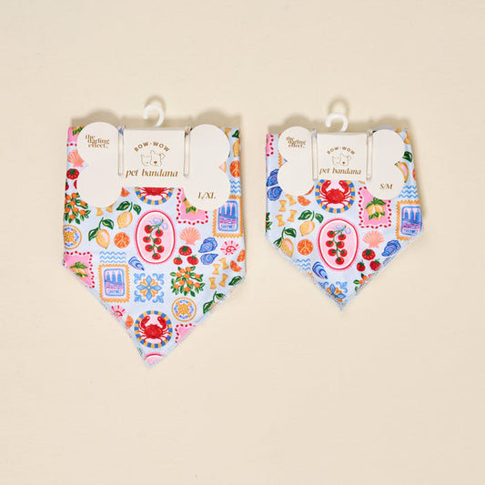 Two The Darling Effect Bow-Wow Pet Bandana-Ciao Bella accessories in L/XL and S/M, with a Mediterranean-inspired print of crabs, lemons, tomatoes, shells, and sardines on light blue—perfect for stylish pet fashion.