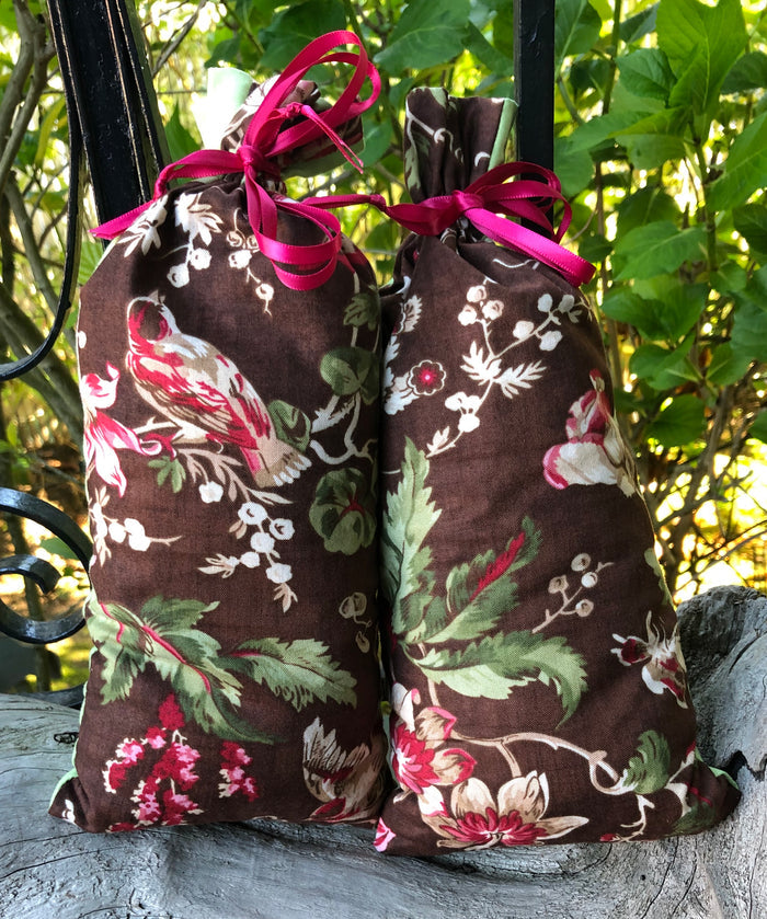 This item consists of ONE Lavender Pillow - the pillow you may receive will be one of two pictured here. The fabric is the same, a brown base with green leaves, white and red berries and birds, but the actual image on the fabric may differ.  The backside is a coordinating green fabric.  This lavender pillow is useful in diminishing stress, easily fits on your bed or couch (or car) and makes a unique gift. The contents of each pillow is lavender, and only lavender, thus there are no other fillers