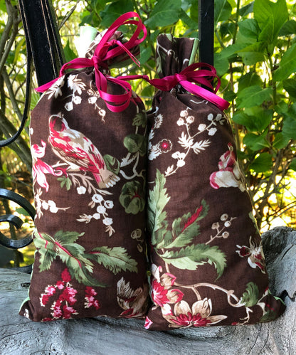 This item consists of ONE Lavender Pillow - the pillow you may receive will be one of two pictured here. The fabric is the same, a brown base with green leaves, white and red berries and birds, but the actual image on the fabric may differ.  The backside is a coordinating green fabric.  This lavender pillow is useful in diminishing stress, easily fits on your bed or couch (or car) and makes a unique gift. The contents of each pillow is lavender, and only lavender, thus there are no other fillers