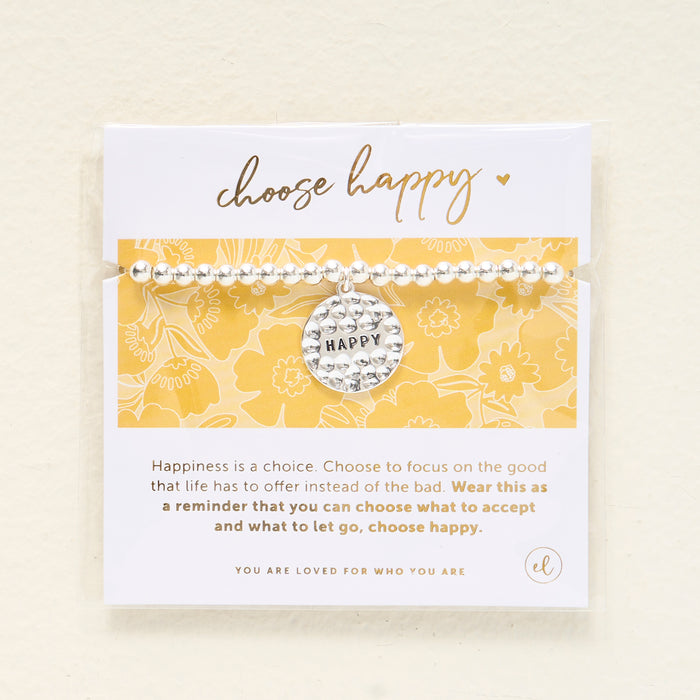 The Darling Effect Choose Happy Beaded Charm Bracelet features a silver beaded design with a round HAPPY charm, displayed on a card that reads "choose happy"—a thoughtful gift to inspire positivity.