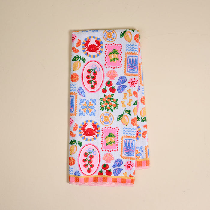 The Ciao Bella Waffle Tea Towel by The Darling Effect features playful crab, cherry, lemon, cake, flower, and abstract prints on white—an absorbent way to brighten any kitchen.