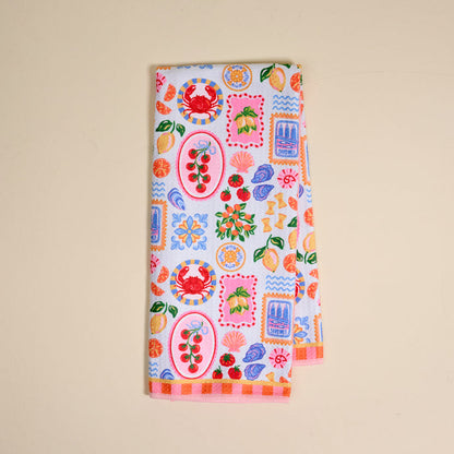 The Ciao Bella Waffle Tea Towel by The Darling Effect features playful crab, cherry, lemon, cake, flower, and abstract prints on white—an absorbent way to brighten any kitchen.