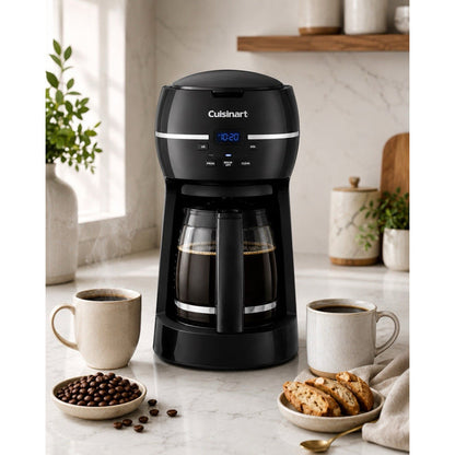 Front catalog scene of black Cuisinart DCC-1500FR coffee maker with filled glass carafe, two mugs, beans, and biscotti.