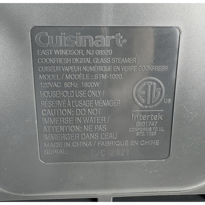 Cuisinart CookFresh steamer underside label showing model STM-1000, 120 VAC, 60 Hz, 1800 W and Made in China.