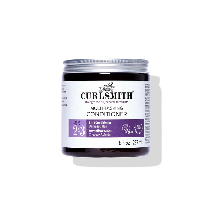 Jar of Curlsmith multi-tasking conditioner on a white background