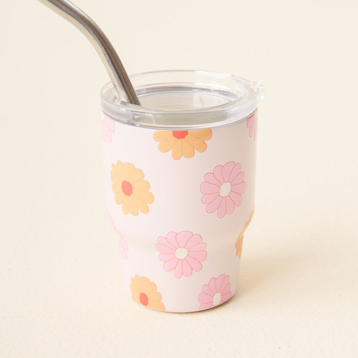 The Darling Daisy Peach 2 oz Tiny Tumbler by the-darling-effect features a pink retro floral design and comes with a metal straw.