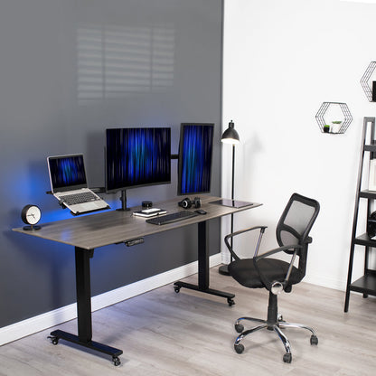 A black desk mount that can hold two monitors and one laptop.