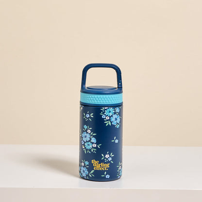 The Darling Effect Endless Daydream Navy 6 oz Lil' Bitty Bottle features a navy petite design with a light blue lid and handle, blue floral patterns, and “the darlings effect” in yellow—ideal for on-the-go hydration.