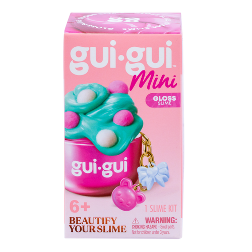 A pink box labeled Gui Gui Mini Backpack Charm Slime by Moose Toys features green and pink slime in a container with a bear keychain. Text includes "Beautify Your Slime," for ages 6+, "1 Slime Kit," and a choking hazard warning.