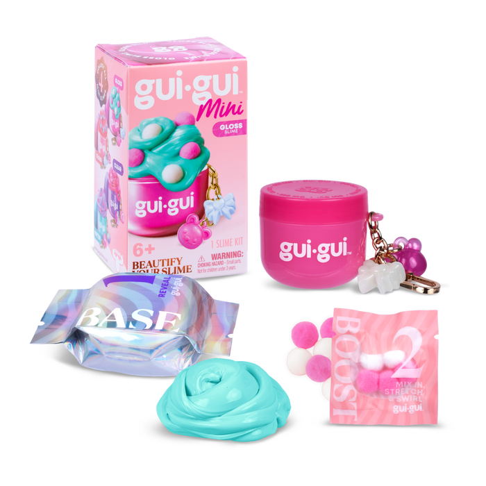The Moose Toys Gui Gui Mini Backpack Charm Slime includes a pink container, pastel blue slime base, BOOST packet with white and pink foam balls, purple keychain, and colorful packaging.