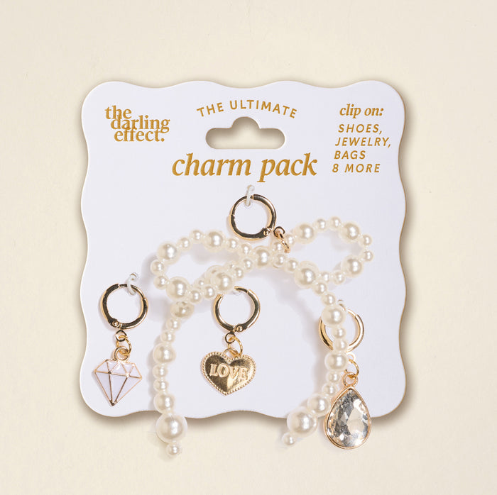 The Darling Effect’s Happily Ever After The Ultimate Charm Pack includes 3 gold and pearl charms—a diamond, LOVE heart, and teardrop gem—ideal for clipping on shoes, bags, or pairing with Make a Statement Necklaces.
