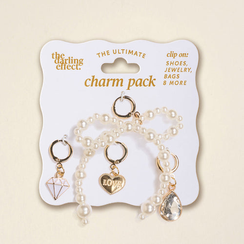 The Darling Effect’s Happily Ever After The Ultimate Charm Pack includes 3 gold and pearl charms—a diamond, LOVE heart, and teardrop gem—ideal for clipping on shoes, bags, or pairing with Make a Statement Necklaces.