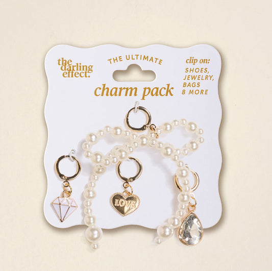 The Darling Effect’s Happily Ever After The Ultimate Charm Pack includes 3 gold and pearl charms—a diamond, LOVE heart, and teardrop gem—ideal for clipping on shoes, bags, or pairing with Make a Statement Necklaces.