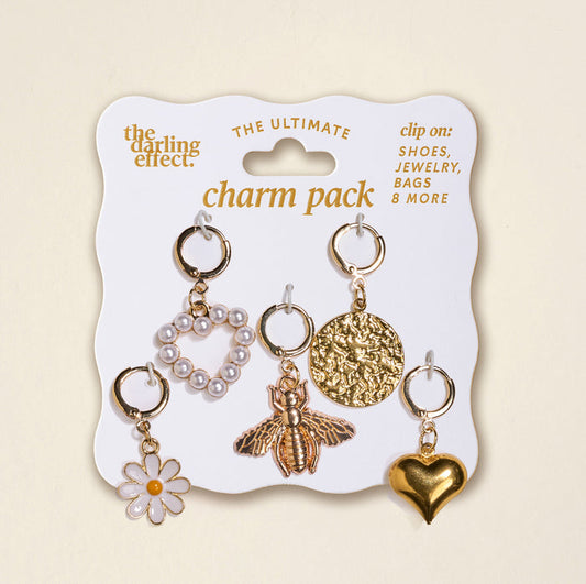 The Darling Effect Honey Bloom The Ultimate Charm Pack includes 5 gold clip-on charms—ideal for shoes, jewelry, bags, necklaces, and more. Mix and match to create your own unique style!.