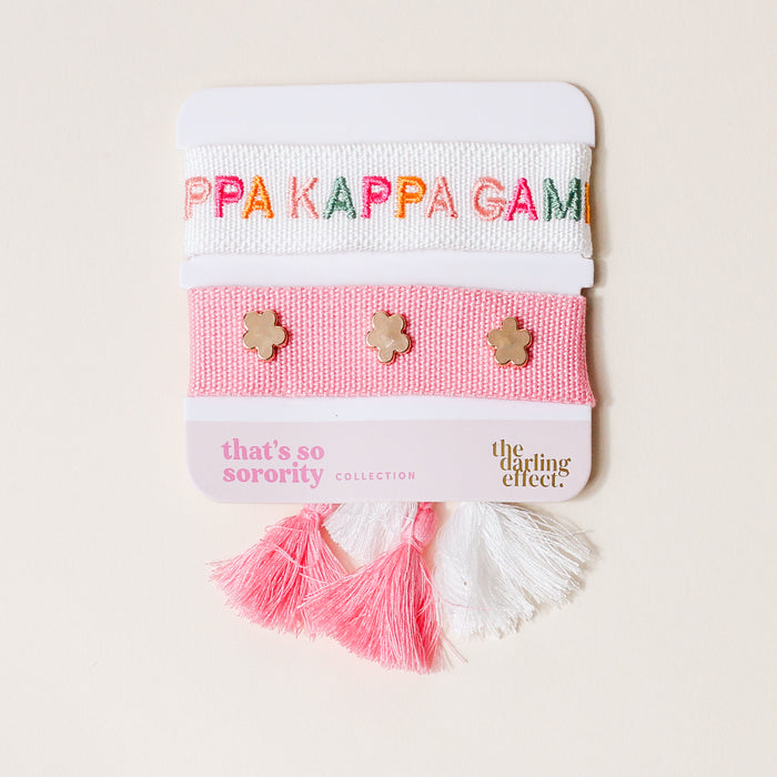 The Darling Effect’s Kappa Kappa Gamma Woven Bracelet Set includes a pink and white elastic bracelet with "KAPPA KAPPA GAMMA" embroidery and a gold flower charm bracelet—perfect for sisterhood gifts or sorority wear.