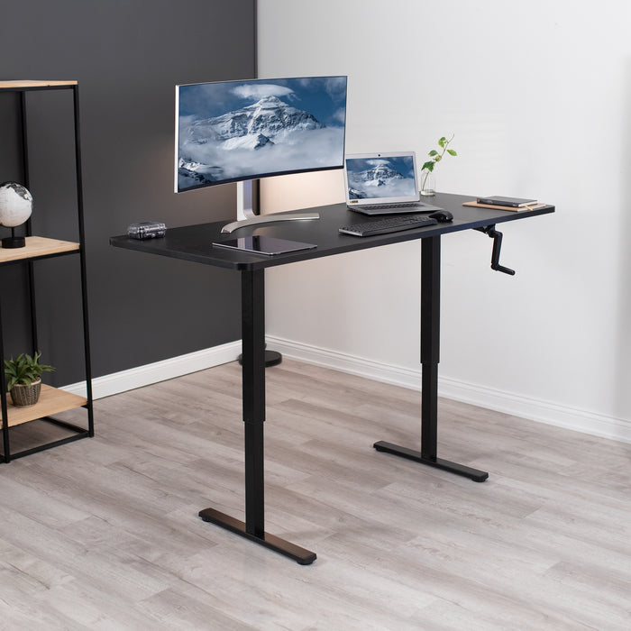 Large three-panel desktop at standing height in an office.