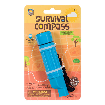 A packaged Outdoor Discovery Survival Compass by Outdoor Discovery for ages 5+. This blue, kid-sized tool features a compass, flint, whistle, signal mirror, waterproof storage, and comes on a card with an orange map background and product info.