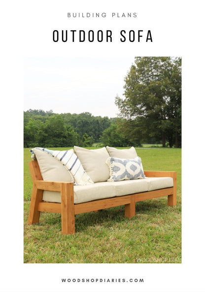 DIY outdoor sofa building plans cover – finished cedar sofa with cushions and throw pillows on a grass lawn