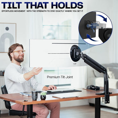Man sitting at a desk with a monitor on a adjustable arm, emphasizing the tilt feature.