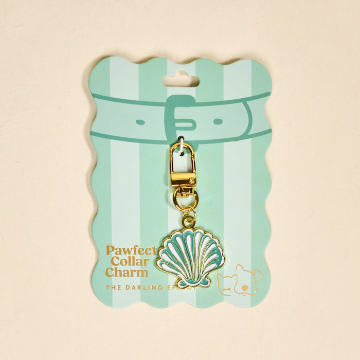 The Darling Effect's Seashell Pawfect Collar Charm features a gold and mint green seashell design on a striped mint card with cat and dog illustrations—an adorable accessory to elevate your pet’s style.