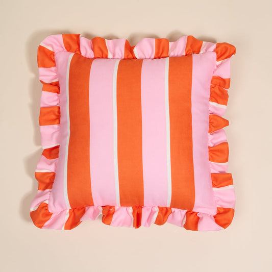 The Darling Effect Sicily Stripes Pink Scalloped Square Throw Pillow features bold vertical pink and orange stripes with wide ruffled edges, set on beige—ideal for adding vibrant flair to your pillow collection.
