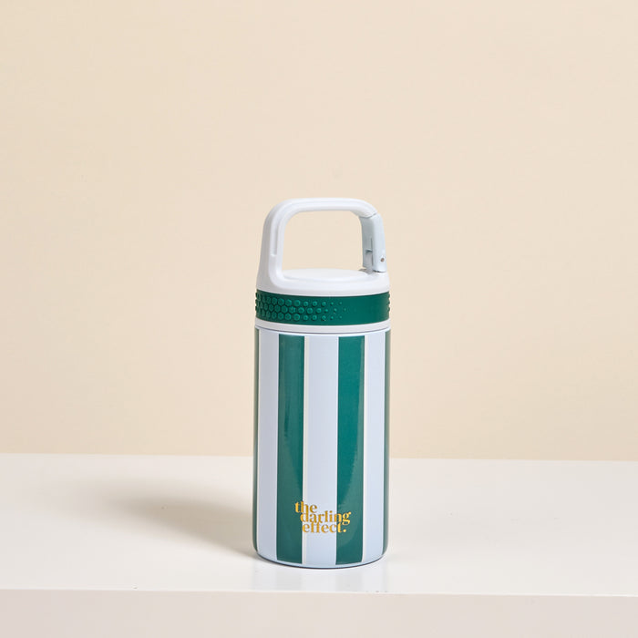 The Darling Effect Sicily Stripes Teal 6 oz Lil’ Bitty Bottle features vertical teal and white stripes, a white handled lid, and gold “the chiller effect” text—a compact travel companion for hydration, shown on a white surface with beige background.