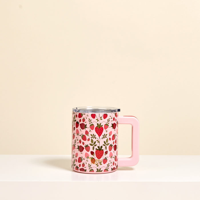 The Darling Effect’s Strawberry Fields 14 oz Insulated Mug features a strawberry pattern, light pink handle, and double-wall insulation to keep drinks hot or cold.