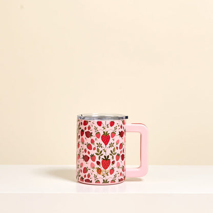 The Darling Effect’s Strawberry Fields 14 oz Insulated Mug features a strawberry pattern, light pink handle, and double-wall insulation to keep drinks hot or cold.