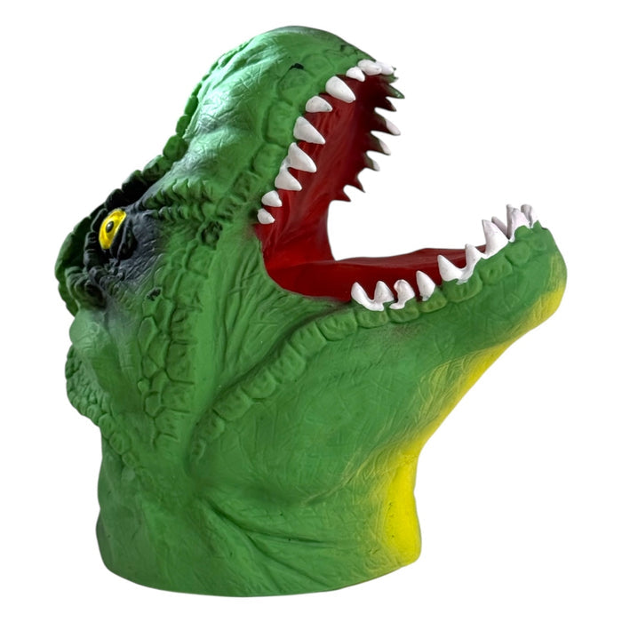 The Toysmith Dino Bite Hand Puppet by Toysmith features a green T-Rex head with yellow accents, textured skin, an open mouth with sharp white teeth, red interior, and a yellow eye. Photographed on a white background. Perfect for fun Dino Bite playtime!.