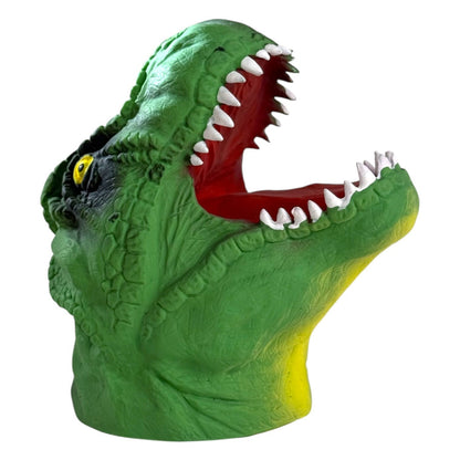 The Toysmith Dino Bite Hand Puppet by Toysmith features a green T-Rex head with yellow accents, textured skin, an open mouth with sharp white teeth, red interior, and a yellow eye. Photographed on a white background. Perfect for fun Dino Bite playtime!.