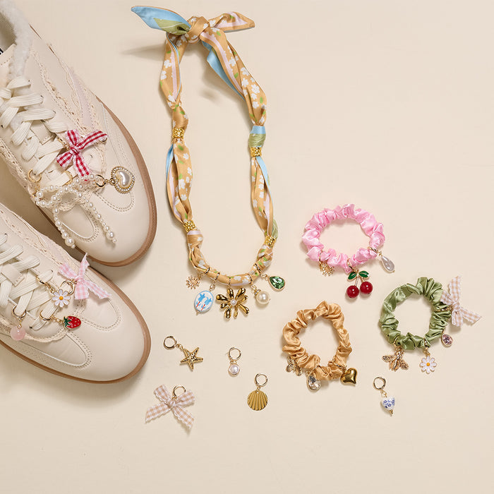 The Darling Effect's Under the Sea The Ultimate Charm Pack is artfully arranged on a cream background.