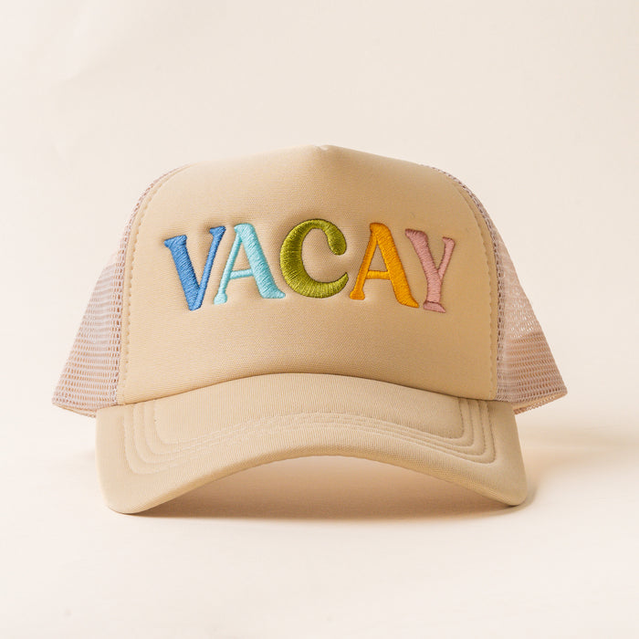 The Vacay Trucker Hat by the-darling-effect features mesh sides and “VACAY” embroidered in colorful letters on beige—ideal for anyone who loves stylish embroidered hats.