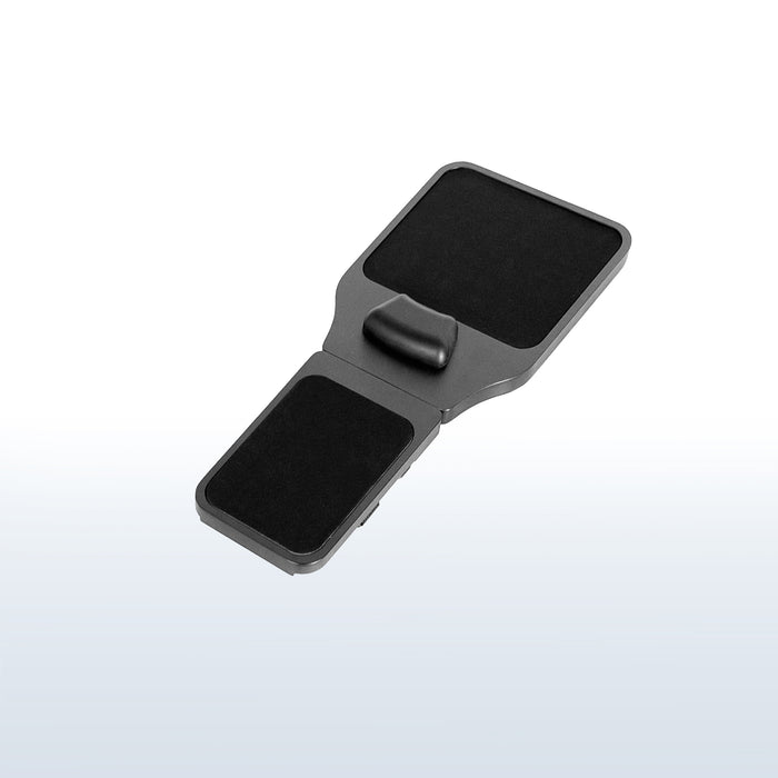 Strap on chair armrest with mouse pad.