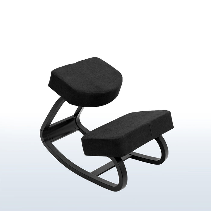 Rocking all-black kneeling chair.