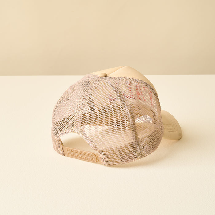 The Y'all Trucker Hat by the-darling-effect is displayed from the back on a light surface, showcasing its adjustable snapback and breathable beige mesh panels—perfect for fans of trendy hats.
